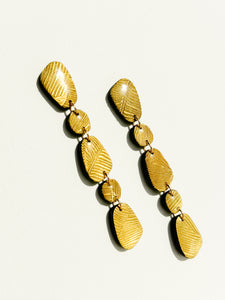 Pebble Drops | gold palm leaf